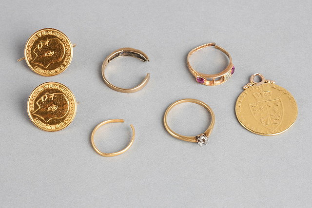 Appraisal: TWO GOLD HALF SOVEREIGNS CONVERTED TO EARRINGS a spade guinea