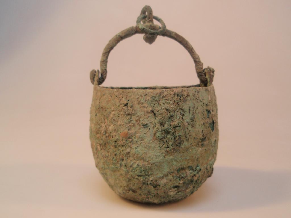 Appraisal: A small heavily corroded bronze bucket or situla the wide