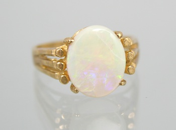 Appraisal: A Ladies' White Opal Ring k yellow gold open design