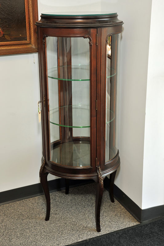 Appraisal: CURIO CABINET Mahohany cylindrical shaped cabinet with two interior glass