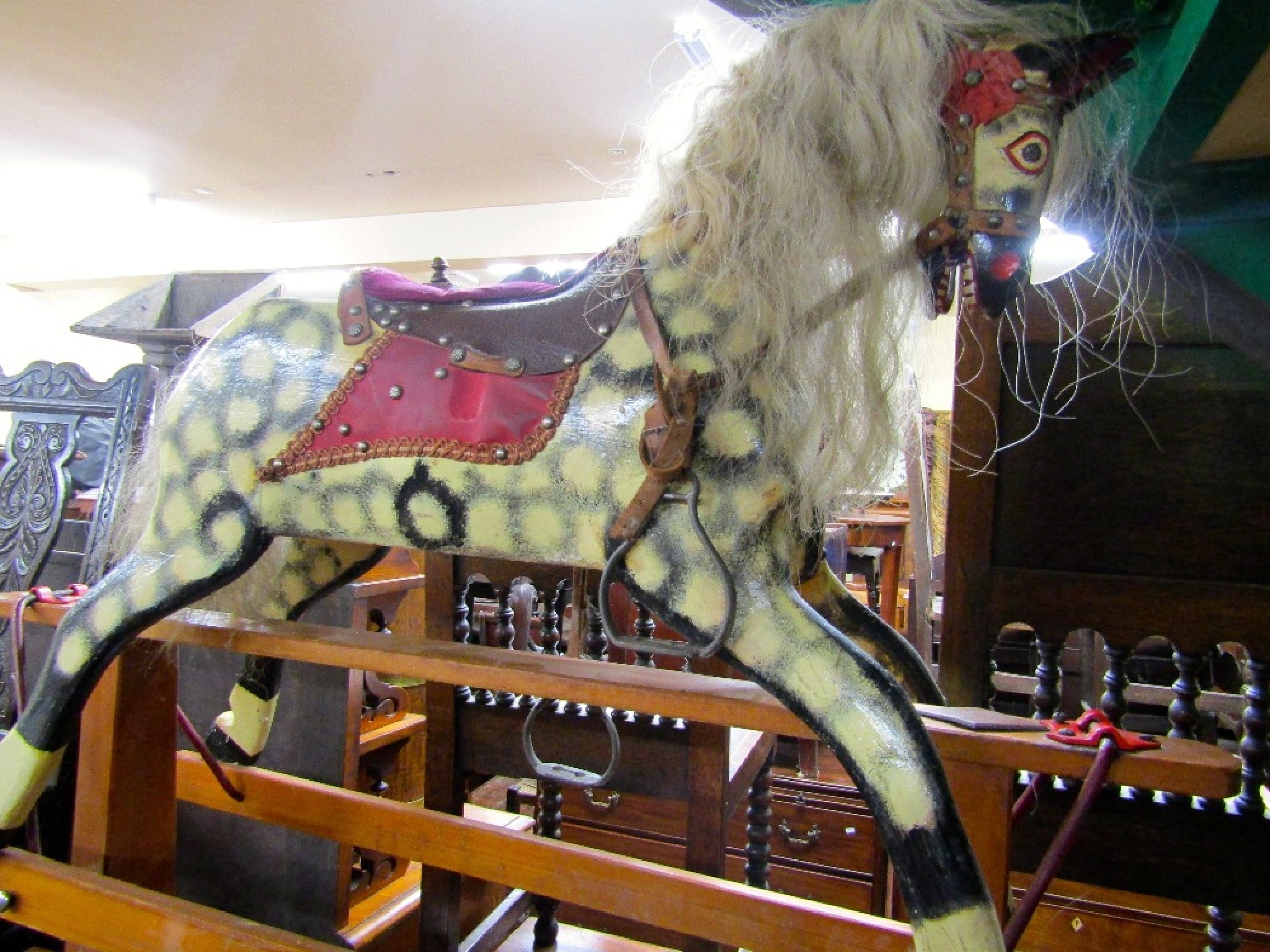 Appraisal: A vintage rocking horse with dapple grey finish raised on