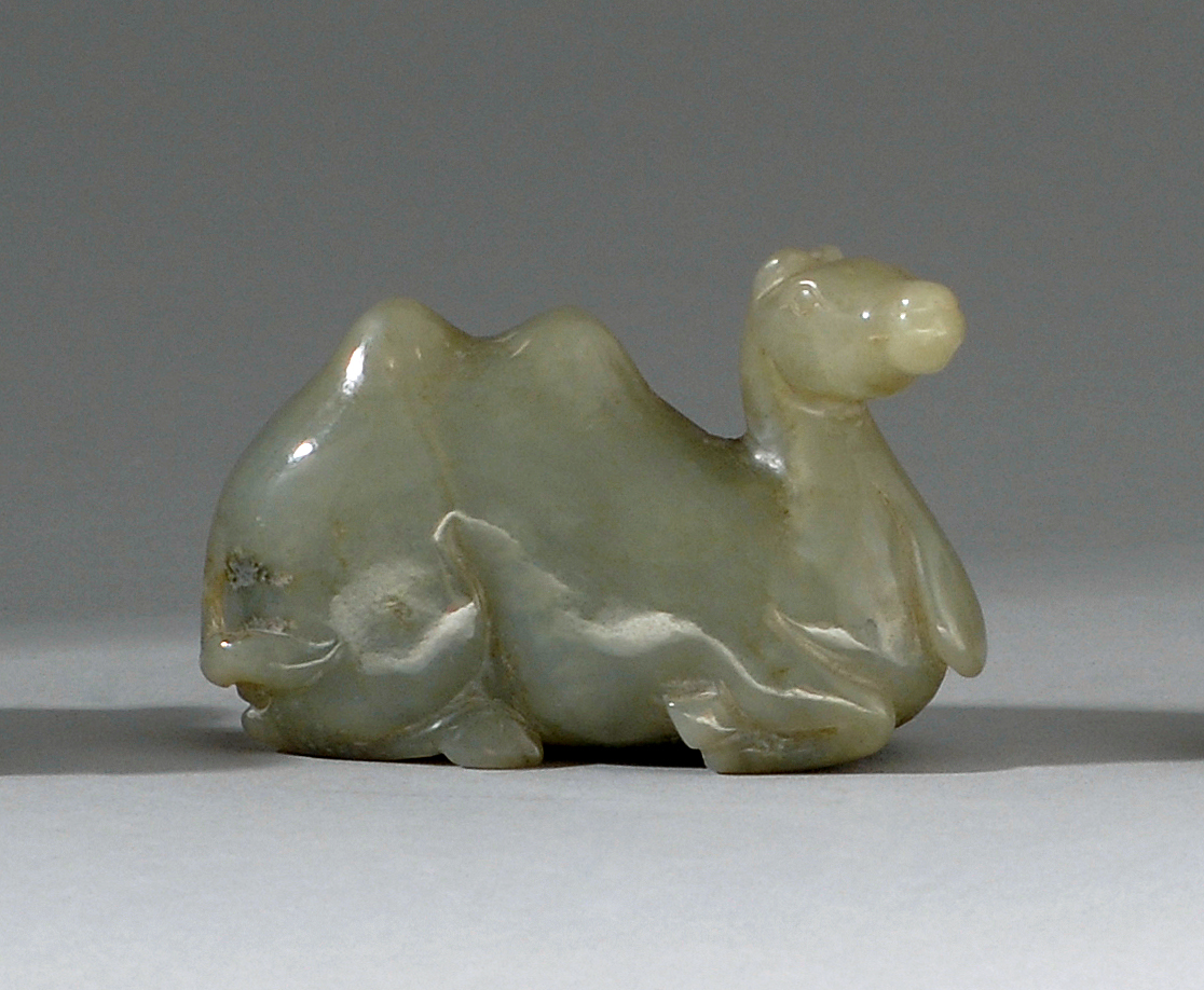 Appraisal: CELADON JADE CARVING th CenturyIn the form of a reclining