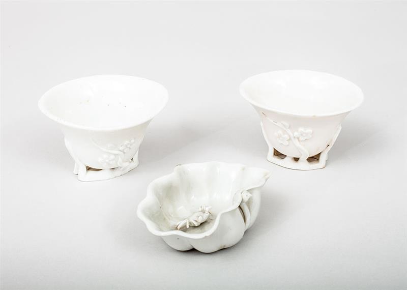 Appraisal: Pair of Chinese Ivory-Glazed Porcelain Rhino Horn-Form Cups and a