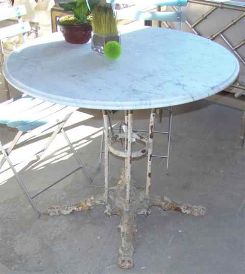 Appraisal: CAST IRON FRENCH BISTRO TABLE WITH MARBLE TOP above four