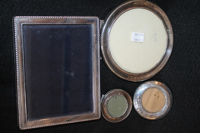 Appraisal: A COLLECTION OF FOUR VARIOUS SILVER PHOTOGRAPH FRAMES with various