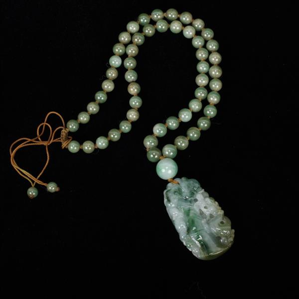 Appraisal: Chinese carved jade pendant on beaded necklace strand beads pendant