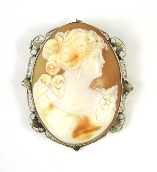 Appraisal: VICTORIAN CAMEO PENDANT BROOCH having a relief carved oval shell