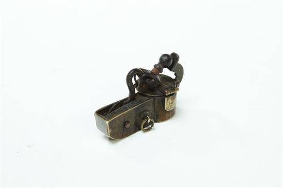 Appraisal: MINIATURE TINDER LIGHTER England th century brass Flintlock tinder lighter