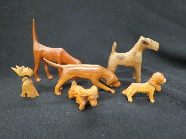 Appraisal: Carved Wooden Dog Figurinesall different tallest is all excellent