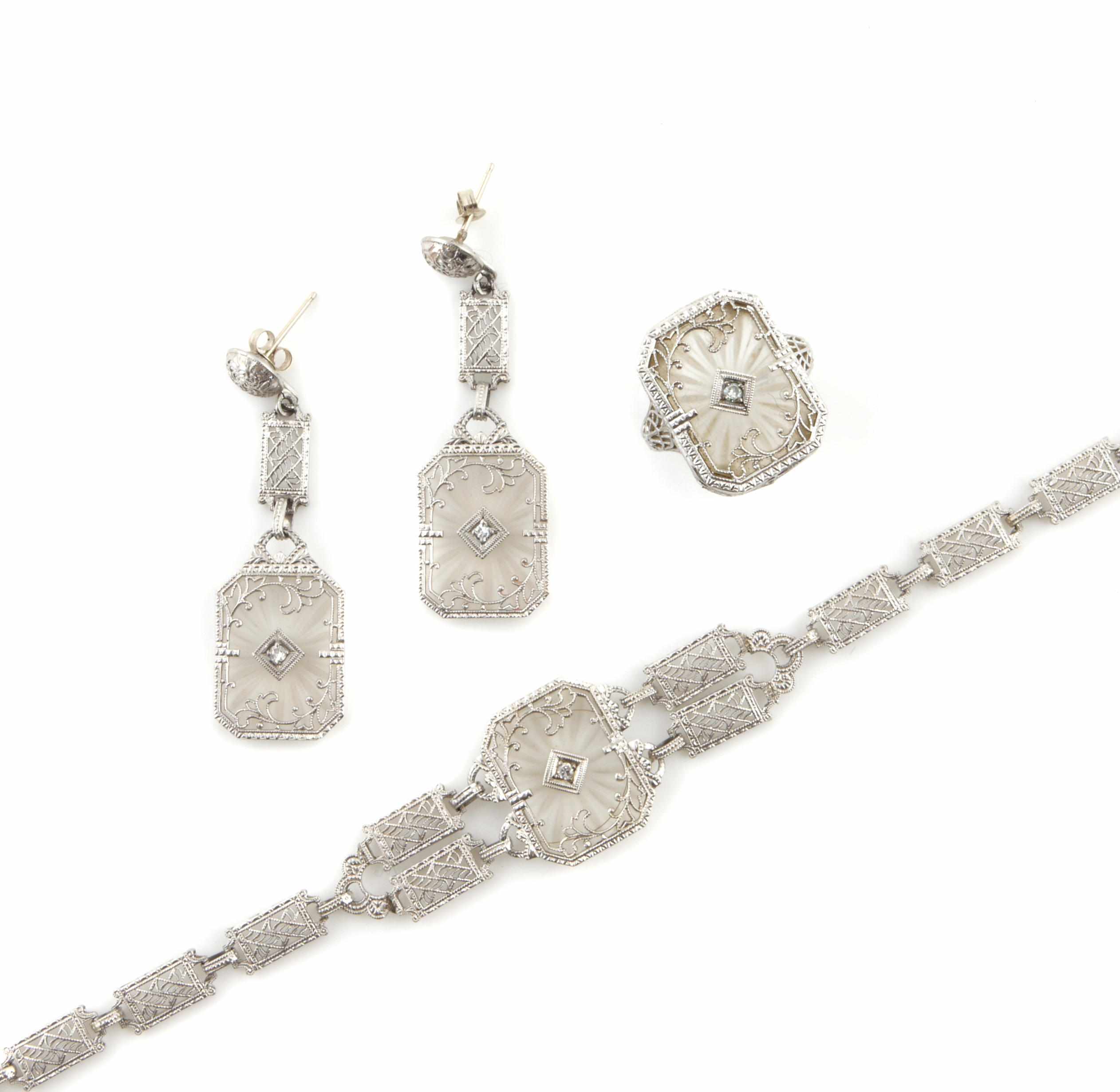 Appraisal: A carved crystal and diamond jewelry set comprising a bracelet