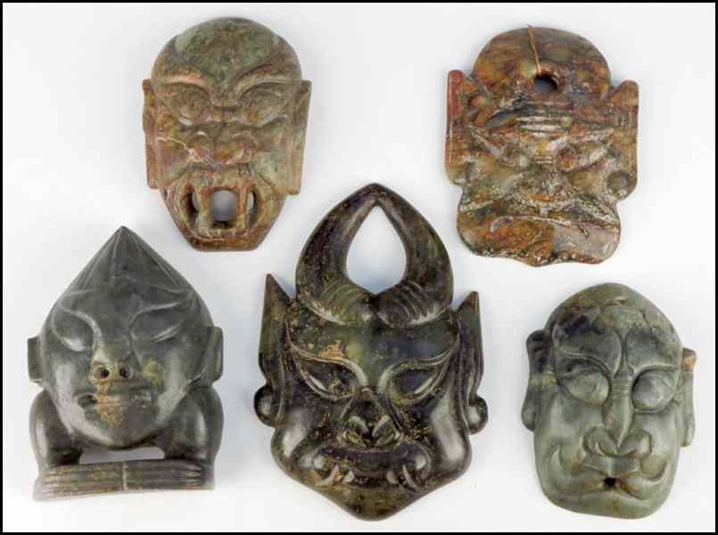 Appraisal: COLLECTION OF FIVE CARVED STONE DEMON MASKS Largest '' x