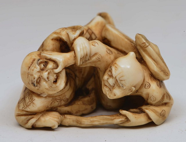 Appraisal: A JAPANESE IVORY NETSUKE two blind men late Meiji -