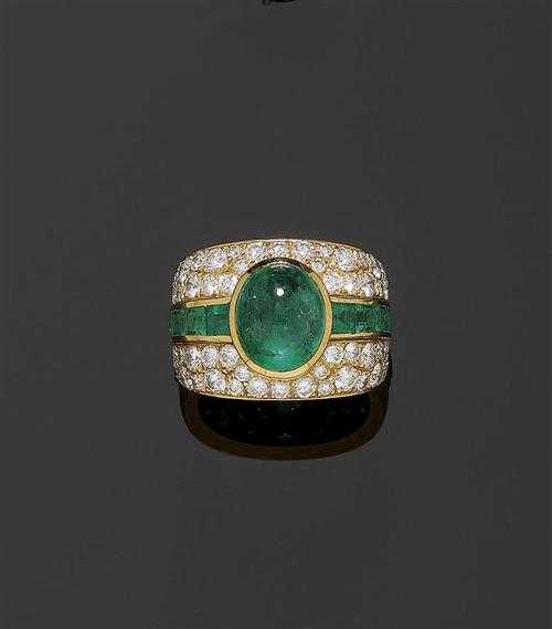 Appraisal: EMERALD AND BRILLIANT-CUT DIAMOND RING Yellow gold Attractive broad band