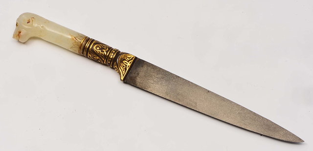 Appraisal: A MUGHAL JADE DAGGER with watered steel blade having a