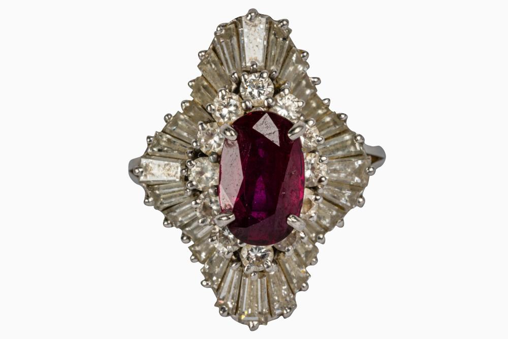 Appraisal: PLATINUM DIAMOND RUBY RINGcentering one oval mixed cut natural ruby