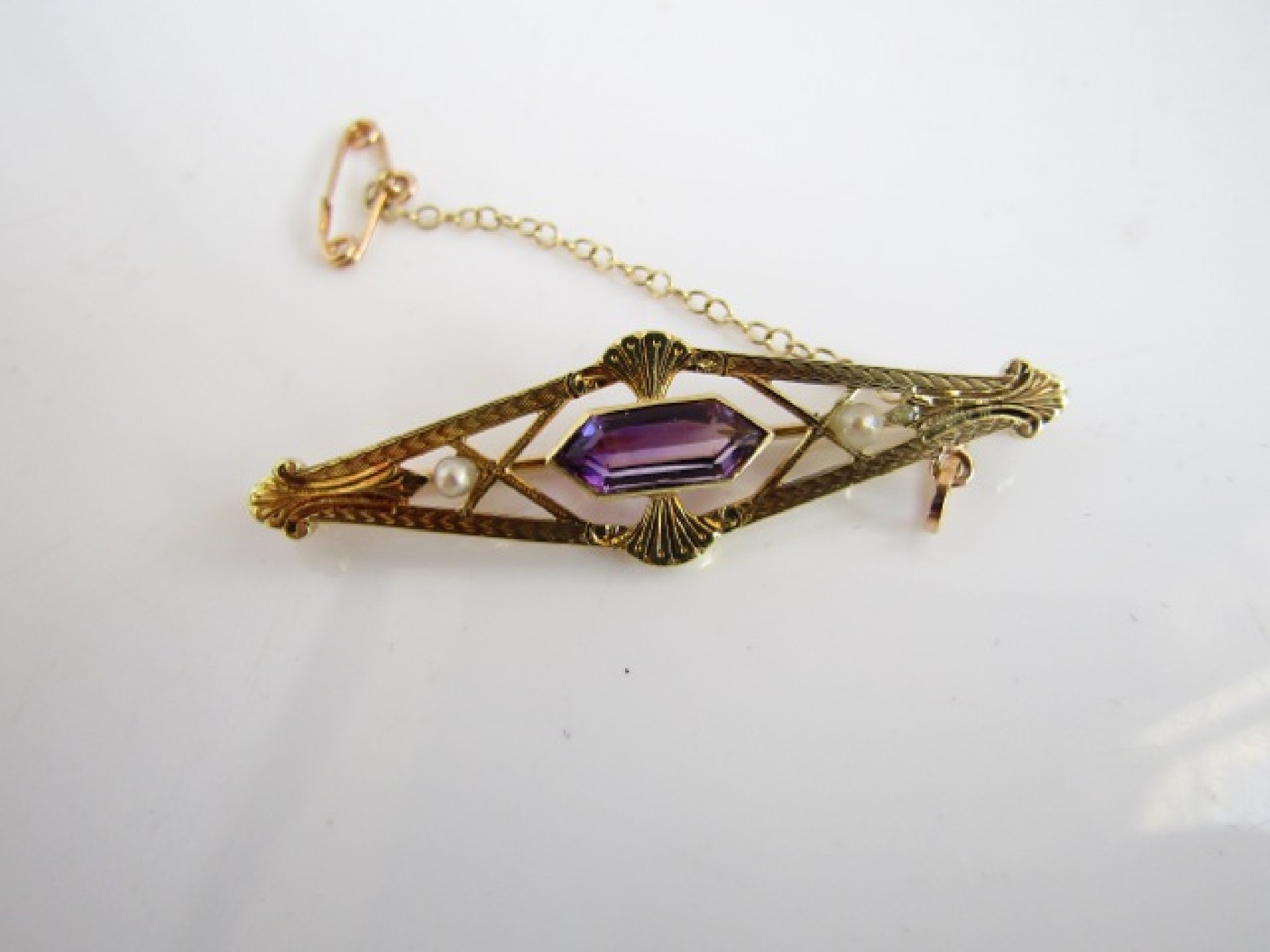 Appraisal: A gem-set brooch of shaped kite form centred with an