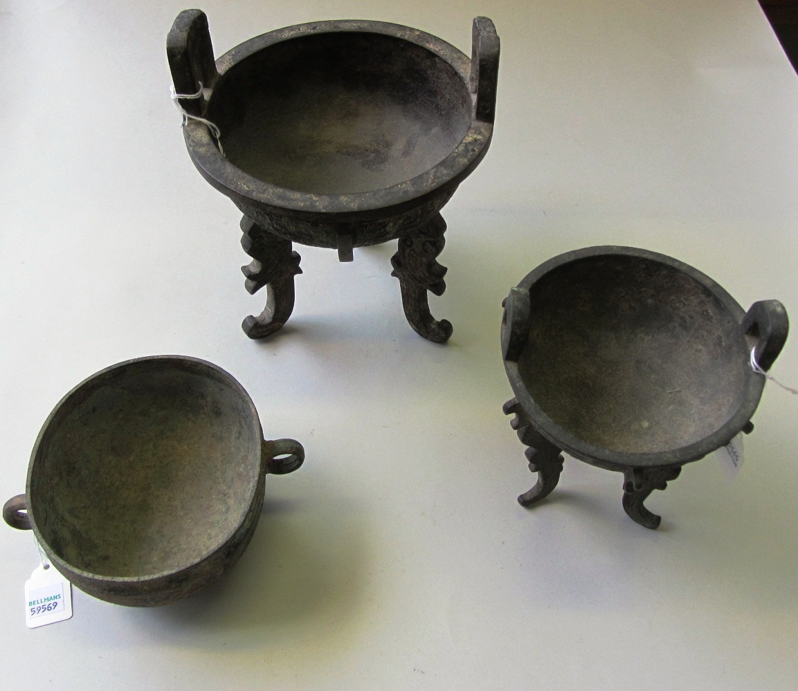 Appraisal: A Chinese archaic style bronze tripod censor with two handles