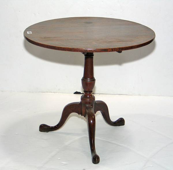 Appraisal: A George III oak tilt top tea table late th