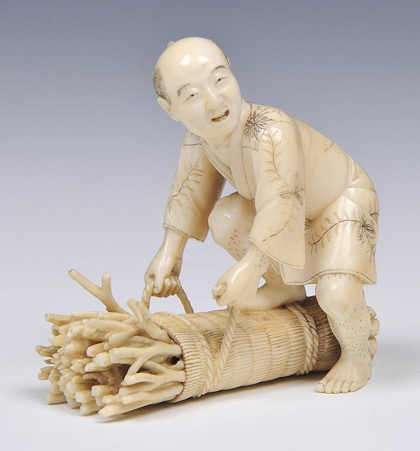 Appraisal: A JAPANESE IVORY OKIMONO of a peasant bending over and