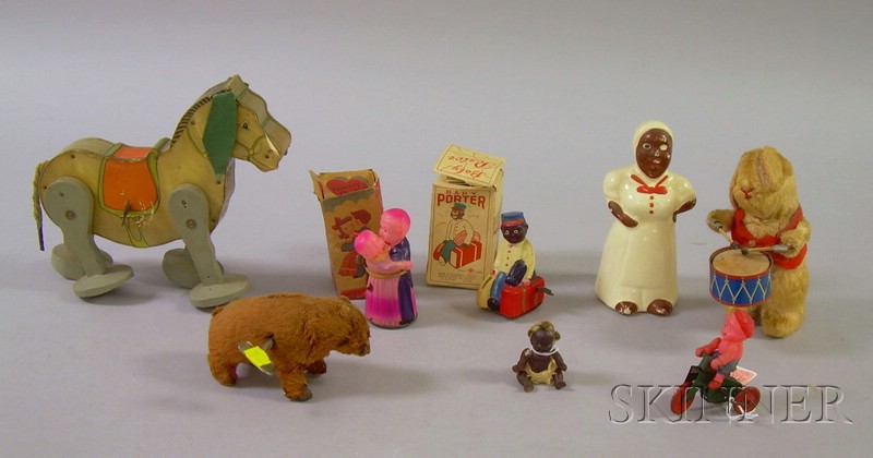 Appraisal: Eight Assorted Wind-up Toys and Black Collectibles a ceramic Mammy