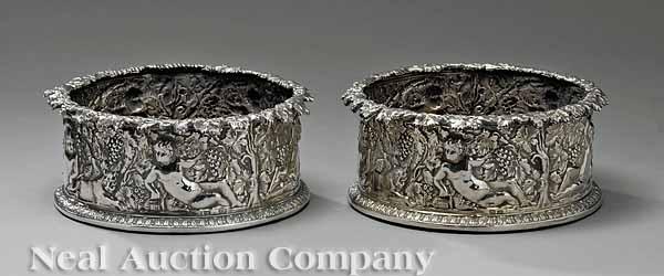 Appraisal: A Pair of Embossed Sterling Silver Magnum Wine Coasters by