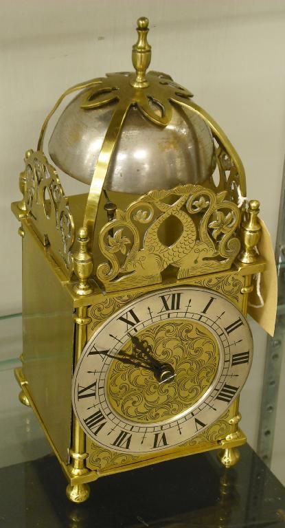 Appraisal: French miniature brass two train striking lantern clock the silvered