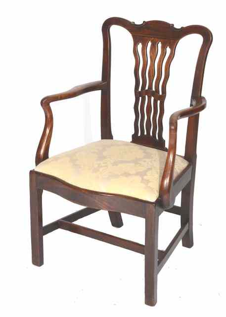 Appraisal: A GEORGE lll MAHOGANY CAMEL BACK ARMCHAIR with wavy splat