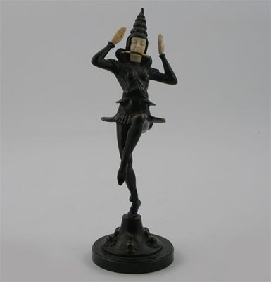 Appraisal: An Art Deco patinated bronze and ivory figure of a