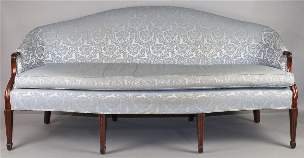 Appraisal: BLUE DAMASK UPHOLSTERED CARVED MAHOGANY SOFA WITH ARCHED BACK having