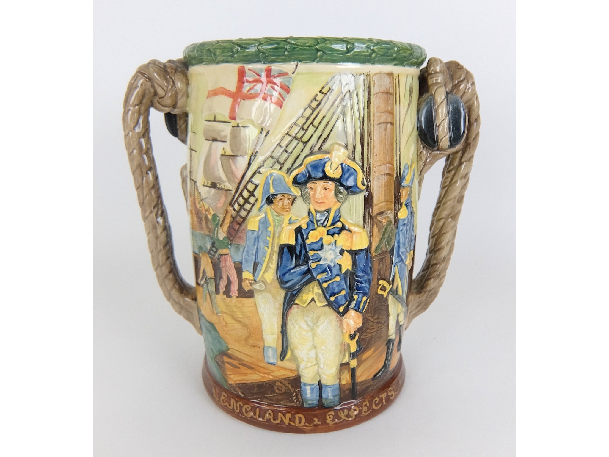 Appraisal: A Royal Doulton commemorative cuplimited edition commemorating Nelson relief moulded