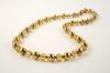 Appraisal: NECKLACE - K yellow gold hollow mm beads alternating with