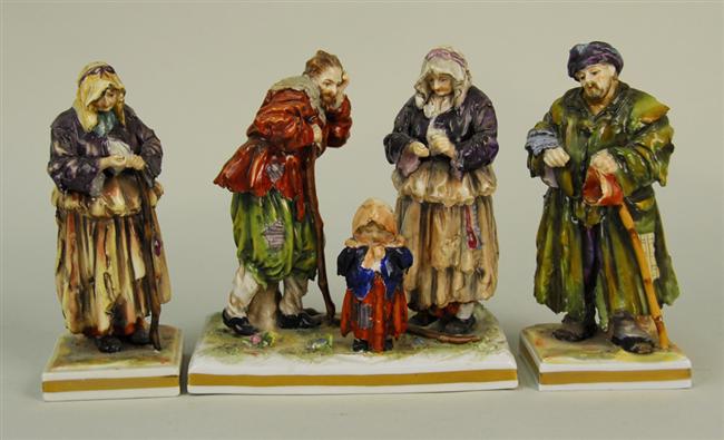 Appraisal: THREE GINORI PORCELAIN FIGURAL GROUPS depicting peasants each bearing crowned