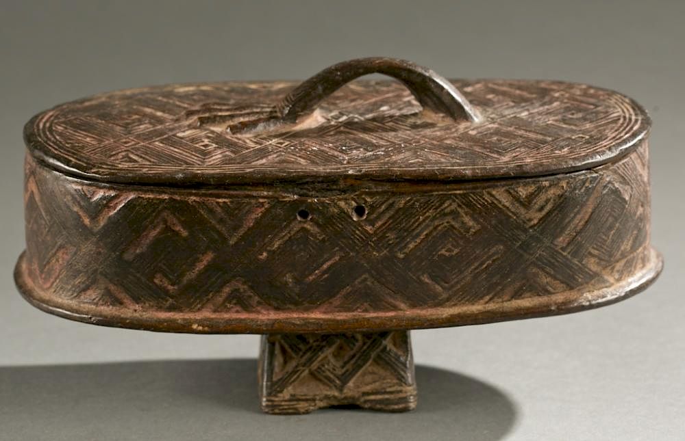 Appraisal: Kuba lidded box th c A lidded incised oval shaped