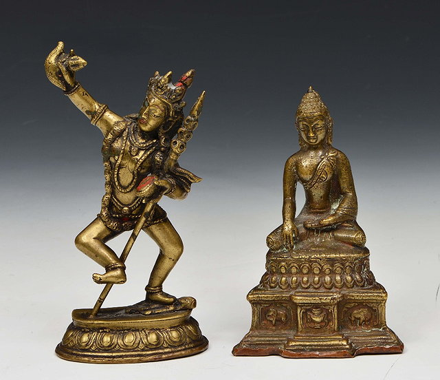 Appraisal: A SINO-TIBETAN BRONZE FIGURE of a Dakini on an oval