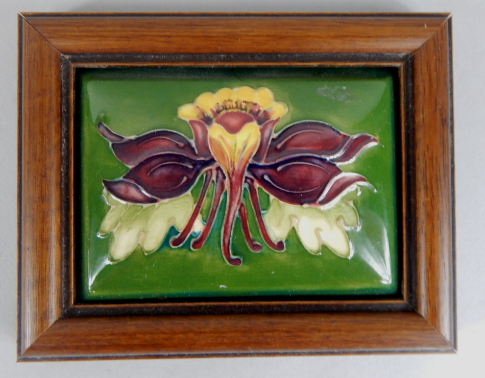 Appraisal: A Moorcroft porcelain rectangular pot lid decorated with a flower