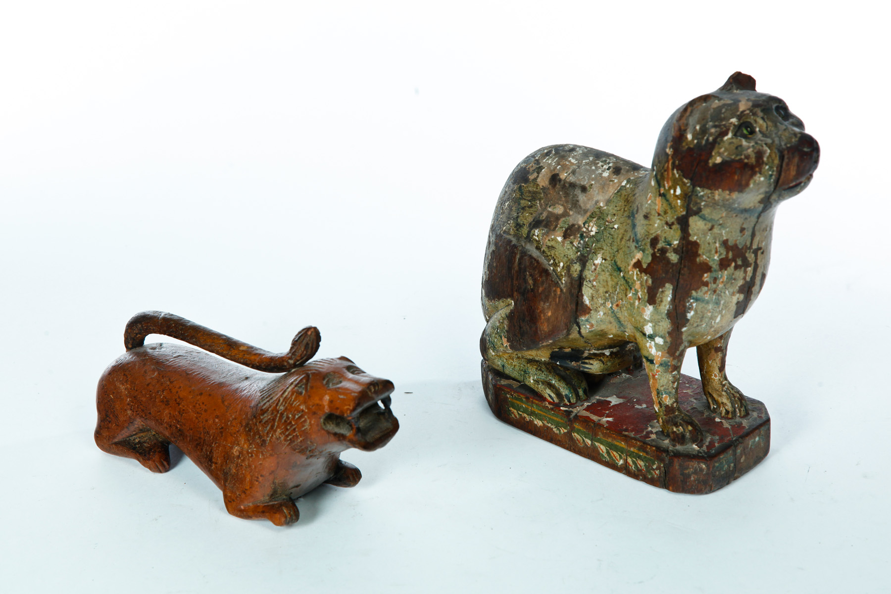 Appraisal: CARVED WOODEN CAT AND LION Probably American th century Seated