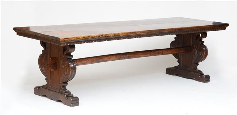 Appraisal: ITALIAN BAROQUE STYLE WALNUT TRESTLE TABLE in x ft in