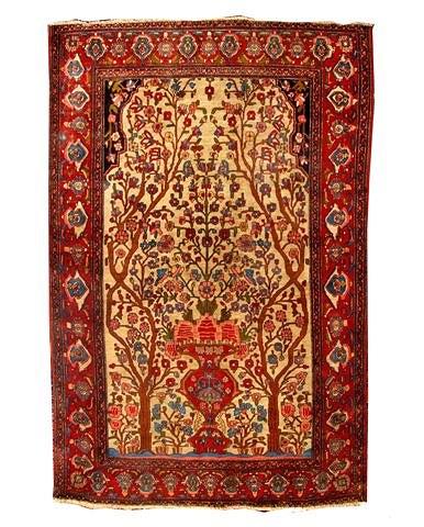 Appraisal: AN ISFAHAN BEIGE GROUND RUG with central urn and double