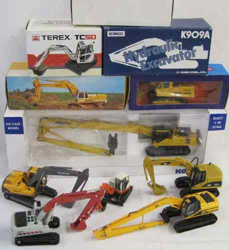 Appraisal: ELEVEN DIECAST SCALE MODELS OF EXCAVATORS Universal Hobbies PC LCD