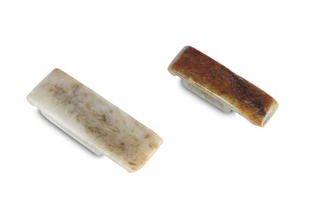 Appraisal: A Chinese white and russet jade scabbard fitting incised decorated