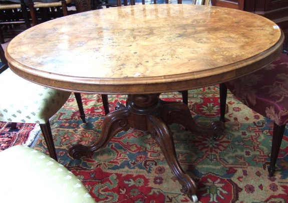 Appraisal: A Victorian walnut marquetry and line inlaid oval loo table