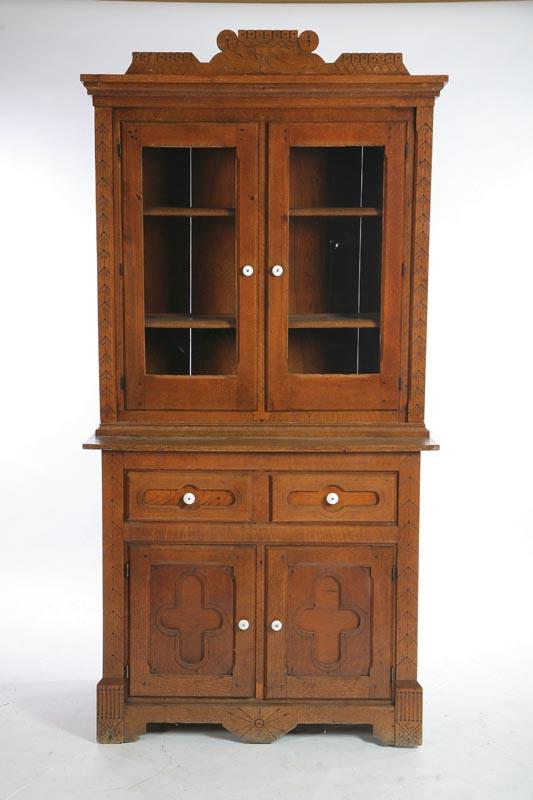 Appraisal: TWO PIECE CUPBOARD Oak and chestnut Top has a carved