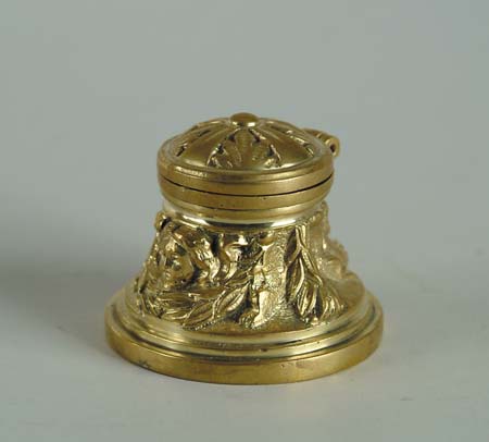 Appraisal: BRASS MODERN INKWELL Round form with glass insert hinged lid