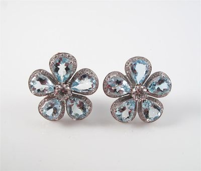 Appraisal: A pair of a aquamarine and diamond flower head earrings