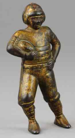 Appraisal: FOOTBALL PLAYER STILL BANK A C Williams cast iron painted