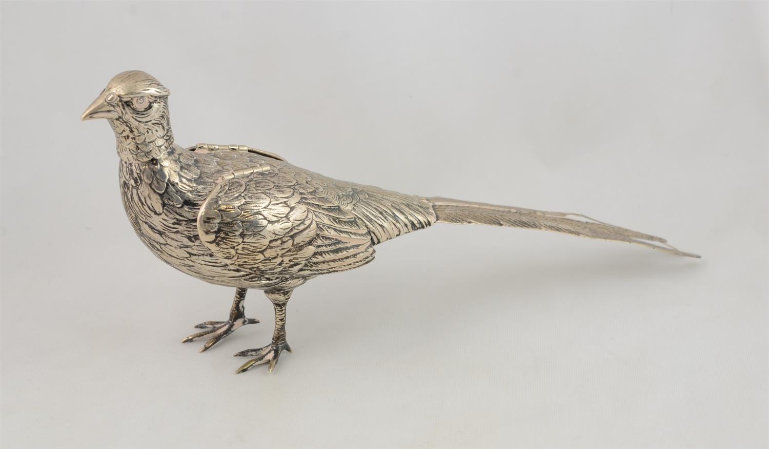 Appraisal: Continental silver pheasant bottle with hinged wings spout with removable