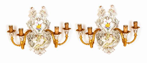 Appraisal: A pair of porcelain and bronze four light sconces height