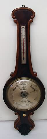 Appraisal: C-scroll cresting over mercury thermometer barometer with steel dial marked