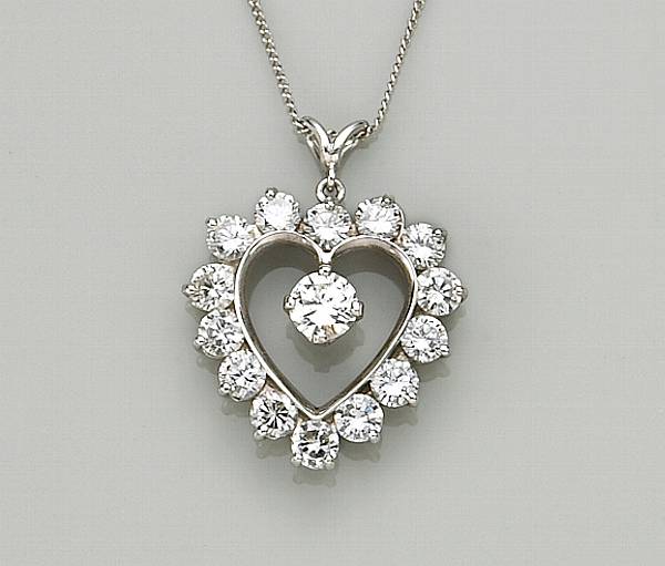 Appraisal: A diamond and platinum heart pendant with k white gold