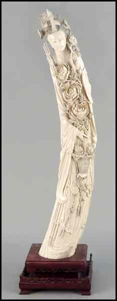 Appraisal: CHINESE CARVED IVORY TUSK Depicting a maiden with basket H